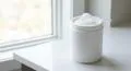 Creatine Monohydrate: Benefits, Dosage & How to Take It 1 Creatine monohydrate powder tub with measuring scoop