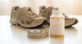 Fat Burners & Weight Loss Supplements: A Buyer's Guide 1 Fat burner supplement bottle with running shoes
